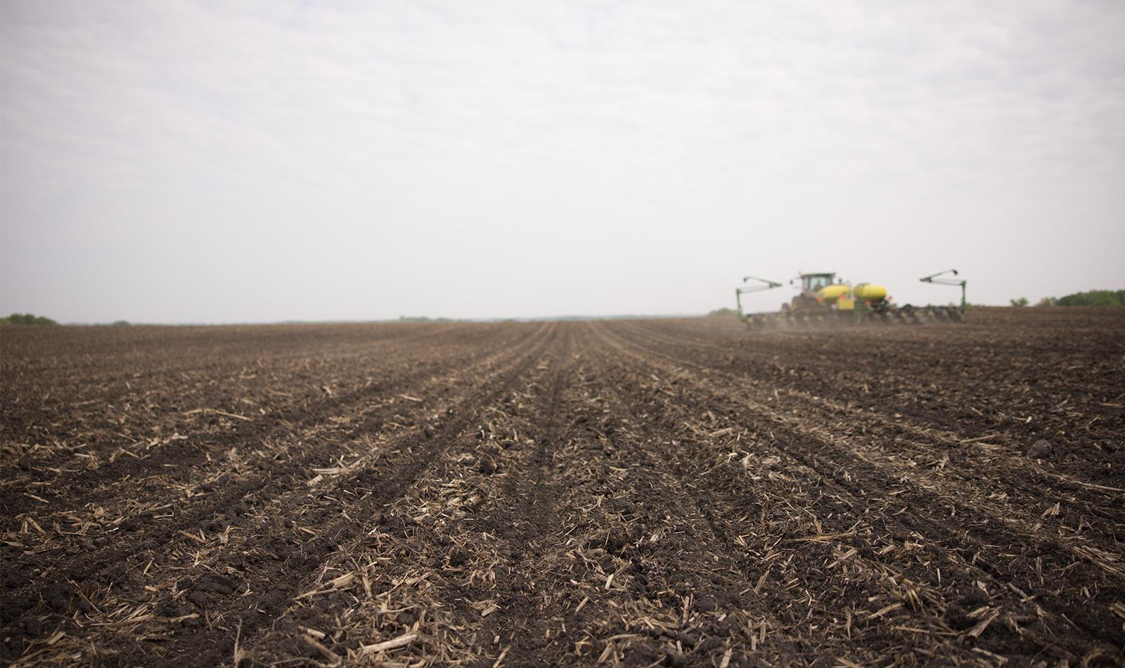 black field being planted