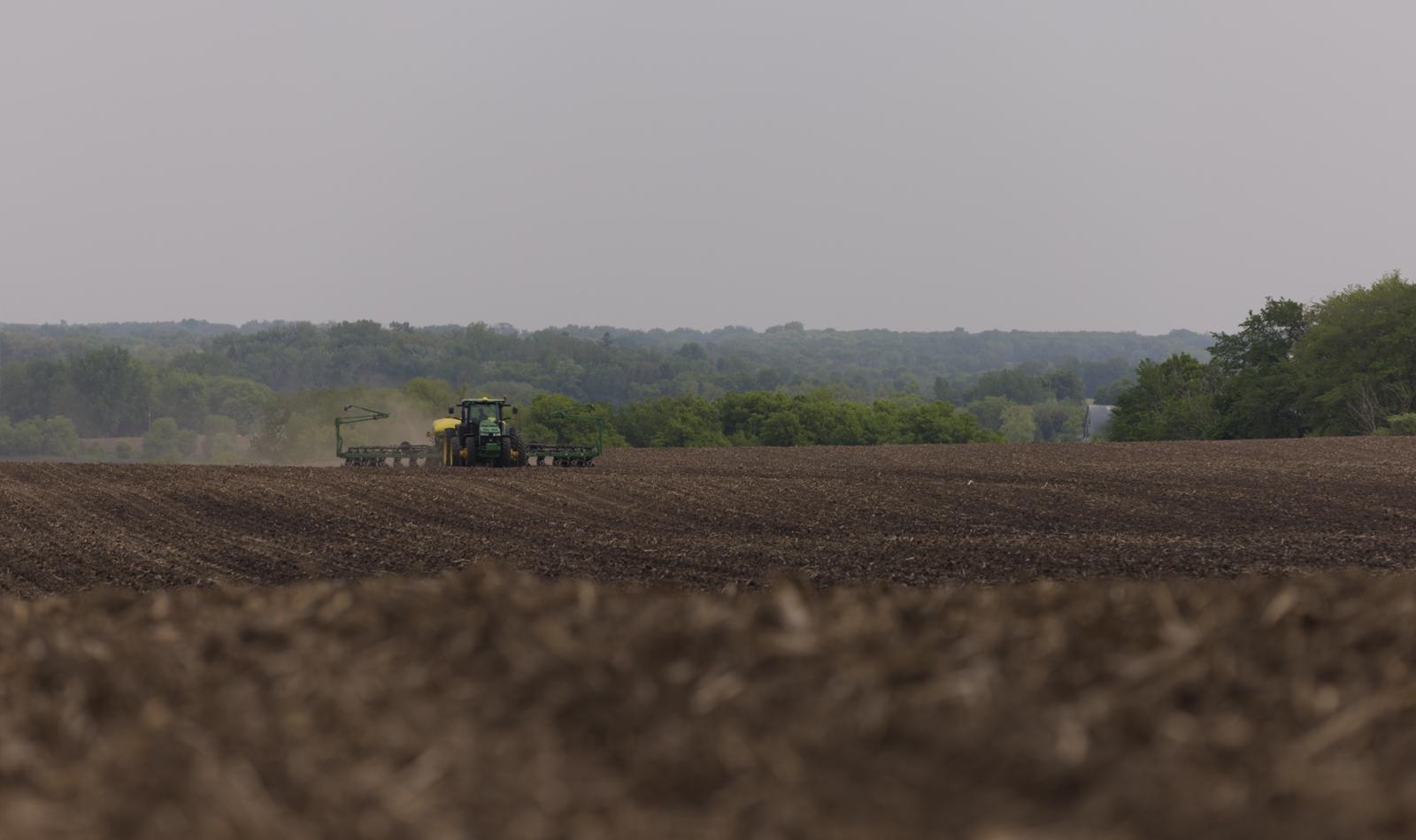 black field being planted